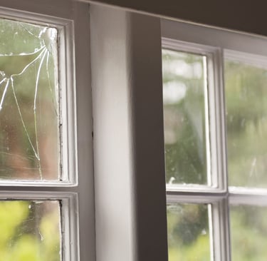 broken glass in timber window