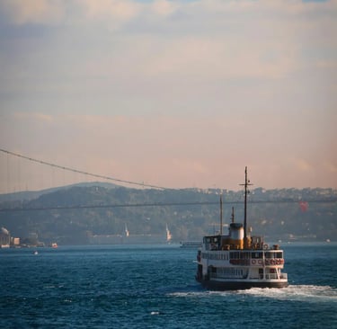 a boat in the water with a bridge in the background