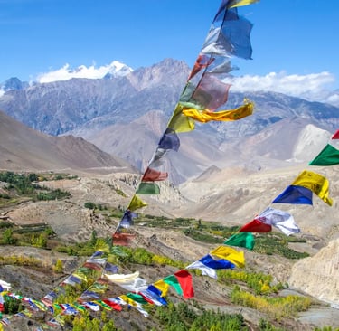 a group of flags and flags hanging from a mountain