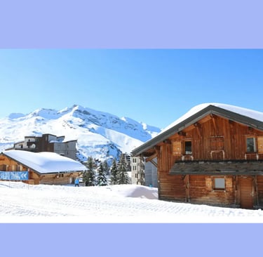 Traditional wooden alpine cabin surrounded by deep snow in a winter mountain setting