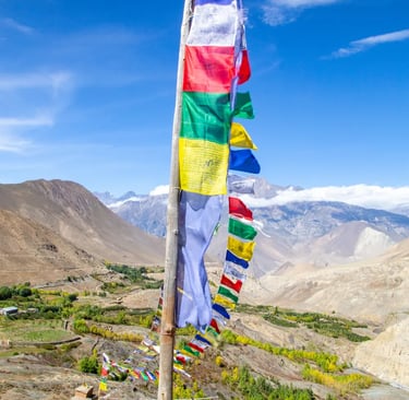 a flagpole with many flags and flags on it