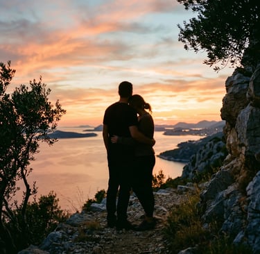 Couple hugging at sunset above the Adriatic Sea on the Dalmatian coast, Croatia