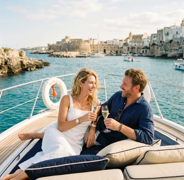 Smiling couple toasting with champagne on private boat in Monopoli