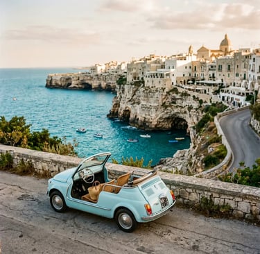 Pastel blue vintage Fiat 500 Spiaggina parked on cliffside road above Polignano a Mare turquoise sea