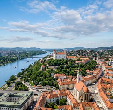 Drone shot of Bratislava Castle on a hill overlooking the Danube River