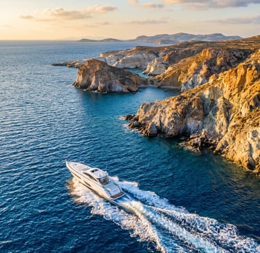Aerial view of luxury speedboat cruising along the volcanic cliffs of Milos at golden hour
