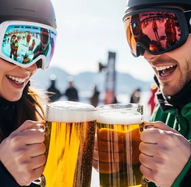 Two skiers toasting with beers during après-ski in Val d’Isère.