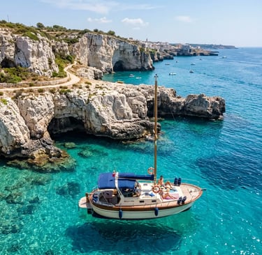 Fratelli Aprea boat anchored in turquoise Adriatic water near Puglia limestone cliffs