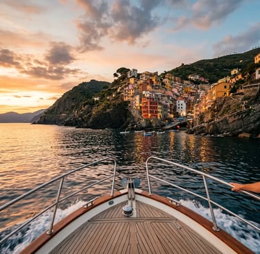 Private boat bow approaching Riomaggiore village at sunset on the Ligurian coastline