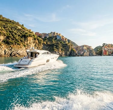 Luxury private boat cruising turquoise Mediterranean Sea near Cinque Terre villages