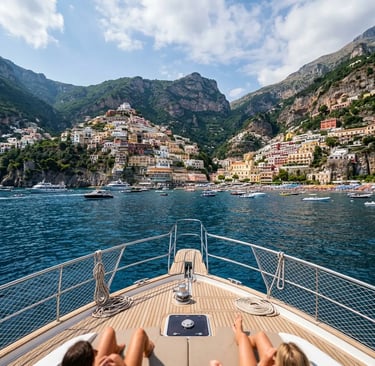 View from luxury catamaran bow toward colorful Positano village on the Amalfi Coast