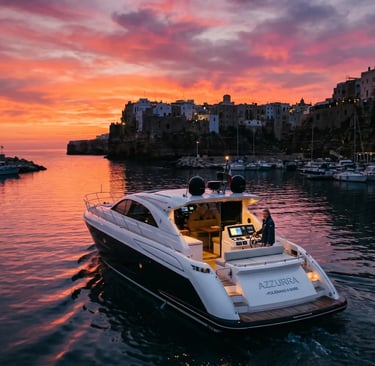 Luxury private boat Azzurra at sunset in Polignano a Mare harbor, Puglia Italy cave tour