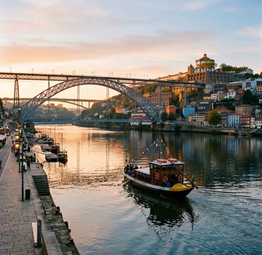 Traditional rabelo cruise boat sailing under Dom Luís I Bridge in Porto at golden sunrise