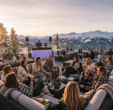 Guests enjoying a lively atmosphere and après-ski drinks with a live DJ on the sunny terrace of Le C