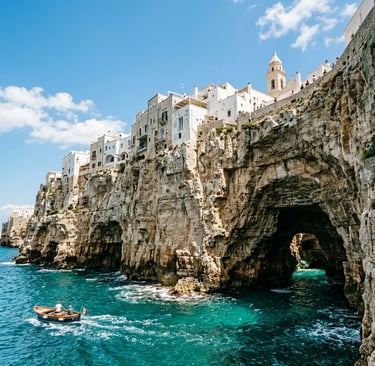 Dramatic Polignano a Mare cliffs with sea caves and boat on turquoise Adriatic water