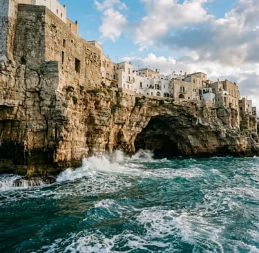 Polignano a Mare limestone cliffs with sea cave and turquoise Adriatic waves Puglia
