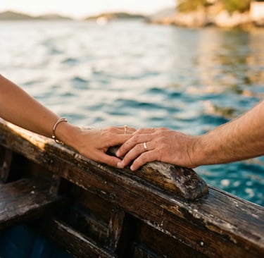 Close up of man and woman hands touching on weathered wooden boat rail at sea