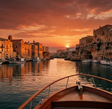Dramatic sunset over Monopoli harbor viewed from teak bow of classic Italian boat