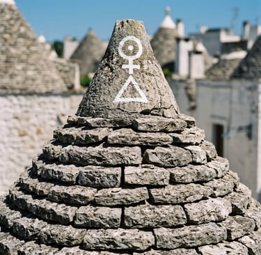 Close-up of ancient symbol painted on trullo stone cone, Alberobello Puglia