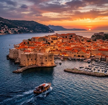 Dubrovnik ancient city walls and terracotta rooftops at sunset from Adriatic Sea