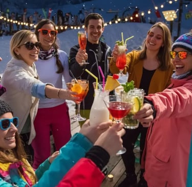 A group of friends cheering with colorful cocktails on a snowy outdoor terrace during an après-ski c