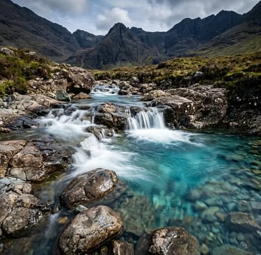  Crystal clear turquoise Fairy Pools with cascading water and Black Cuillin Mountains behind
