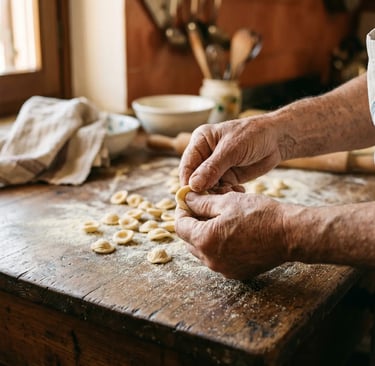 Close-up of weathered hands shaping fresh orecchiette pasta on rustic wooden table in Lecce