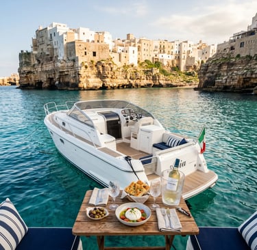 Luxury private boat anchored by Polignano cliffs with burrata, focaccia and wine on deck