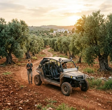 4-seater off-road buggy parked on red dirt track in Puglia olive grove at golden hour