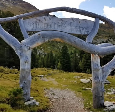 Rustic wooden hiking trail archway in the Tyrolean mountains, Austria.