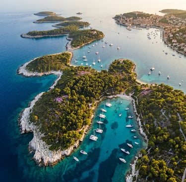 Aerial view of Hvar town and Pakleni Islands with turquoise bays and luxury yachts at sunset