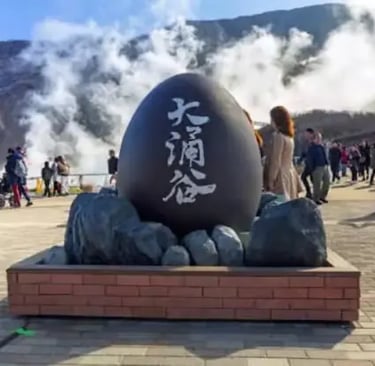 Giant black egg monument at Owakudani volcanic valley in Hakone, famous for its sulfur springs and t