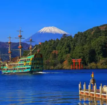 Hakone pirate ship cruising on Lake Ashi with a view of Mount Fuji and the red Torii gate on the wat