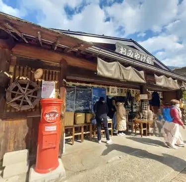 Traditional wooden shop and red post box in Takayama Old Town
