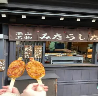 Grilled Gohei Mochi rice cakes at a Takayama street food stall