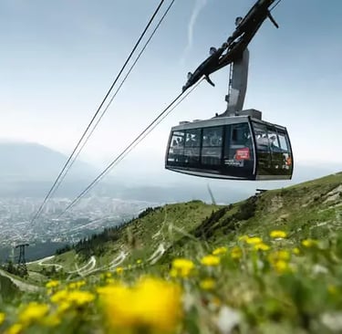 Innsbruck cable car ascending Nordkette mountain with scenic Alpine views.