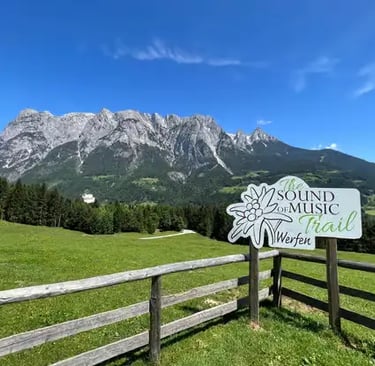 The official Sound of Music Trail sign in the mountains of Werfen.