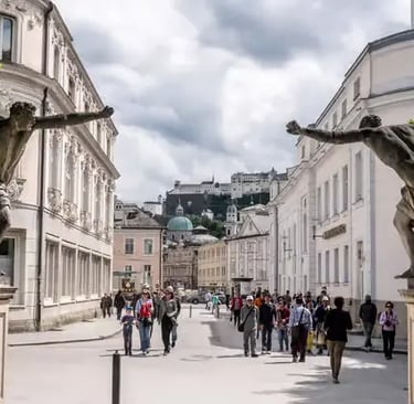 Mirabell Gardens entrance statues with Hohensalzburg Fortress view