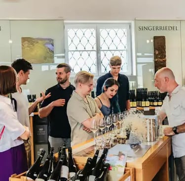 A group of travelers enjoying a premium wine tasting experience at an Austrian winery.