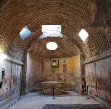 Interior of ancient Roman baths in Pompeii with vaulted brick ceiling and oval skylight
