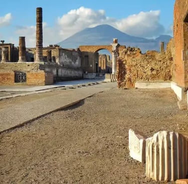 Pompeii ancient forum street with Mount Vesuvius volcano in the background, Italy