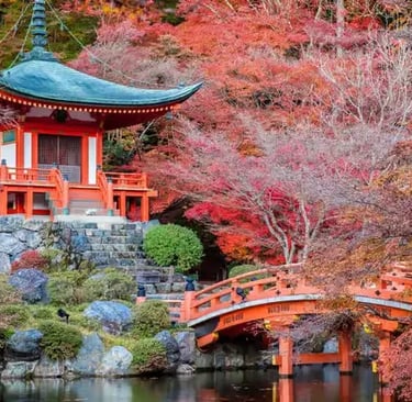 Red Daigo-ji temple pagoda surrounded by vibrant autumn maple trees in Kyoto