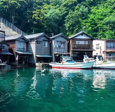 Traditional Japanese fishing village with boats on turquoise water, Japan
