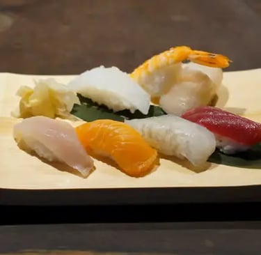 Fresh nigiri sushi assortment on wooden board at Kyoto restaurant