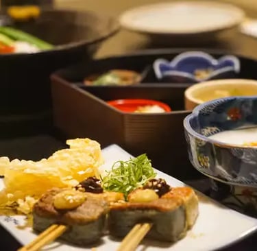 Traditional Japanese multi-course meal with tempura and small plates