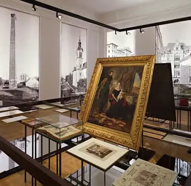 Historic Graz Museum interior with golden-framed painting and archival display cases