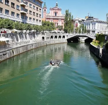 Scenic boat ride on the river in Ljubljana city center.