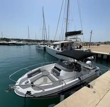 Modern private speedboat docked at sunny marina in Polignano a Mare, Italy