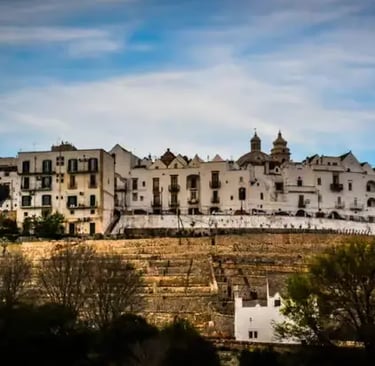 Locorotondo hilltop town on terraced ridge overlooking Puglia countryside