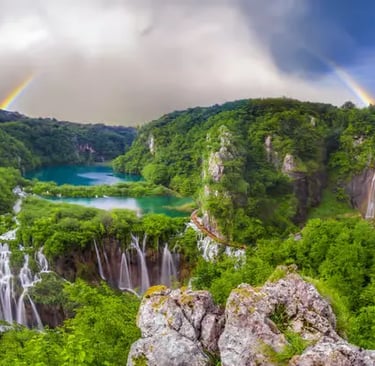 Aerial view of Plitvice Lakes waterfalls with double rainbow, Croatia